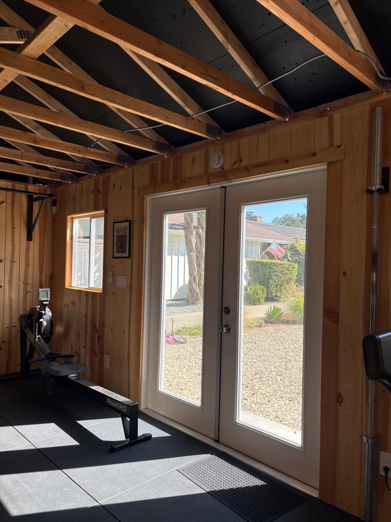 Wide shot of the gym doors and Concept2 rower