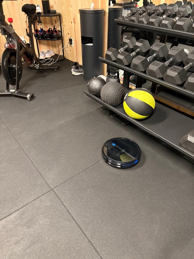 eufy robot vacuum on the gym floor